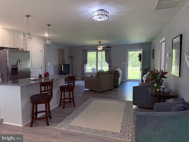 14273 Brandy Ln, Georgetown, DE 19947 - living area with wood finished floors, a ceiling fan, and baseboards