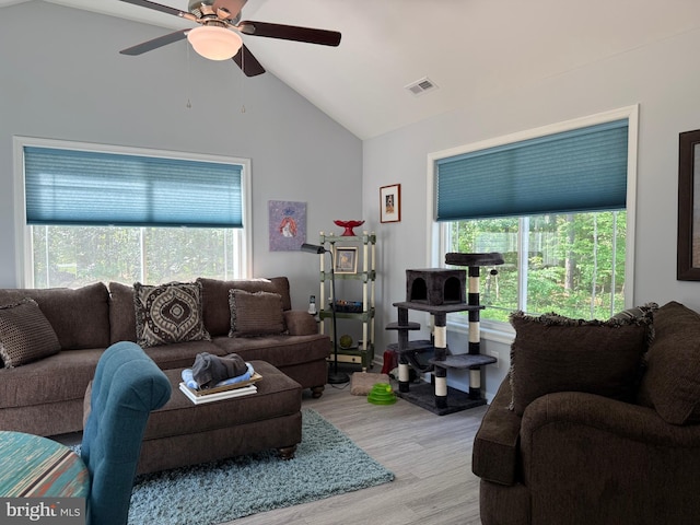 14273 Brandy Ln, Georgetown, DE 19947 - living room featuring vaulted ceiling, light wood-type flooring, and a ceiling fan