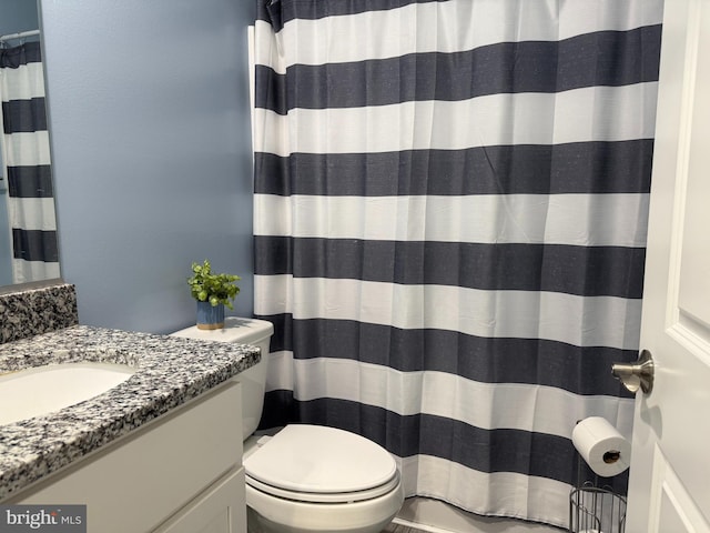 14273 Brandy Ln, Georgetown, DE 19947 - bathroom featuring vanity, toilet, and curtained shower