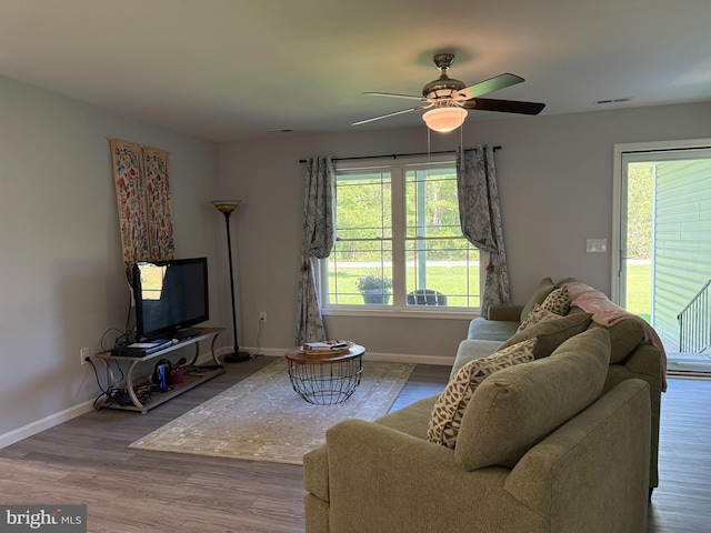 14273 Brandy Ln, Georgetown, DE 19947 - living area with baseboards, healthy amount of natural light, and a ceiling fan