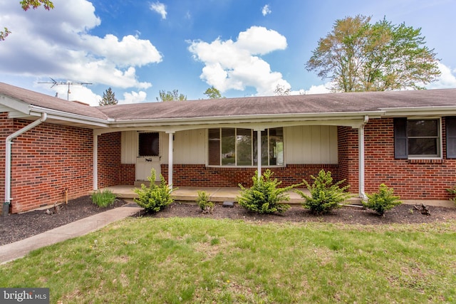 2500 Eberhart Rd, Quakertown, PA 18951 - view of front of property with brick siding, covered porch, and a front yard