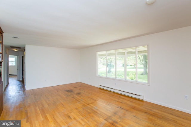 2500 Eberhart Rd, Quakertown, PA 18951 - unfurnished room with light wood-style floors, baseboards, a baseboard heating unit, and visible vents