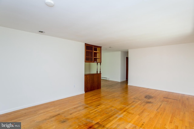 2500 Eberhart Rd, Quakertown, PA 18951 - empty room with light wood-type flooring, baseboards, a baseboard heating unit, and visible vents
