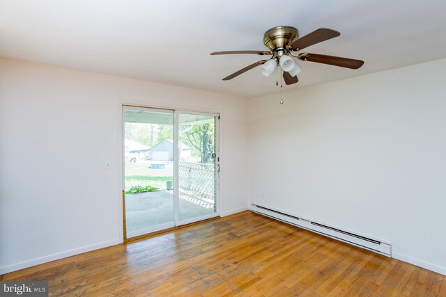 2500 Eberhart Rd, Quakertown, PA 18951 - spare room featuring baseboards, a ceiling fan, a baseboard heating unit, and wood finished floors