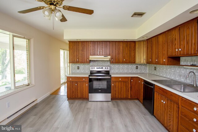 2500 Eberhart Rd, Quakertown, PA 18951 - kitchen featuring stainless steel electric range, a sink, baseboard heating, dishwasher, and under cabinet range hood