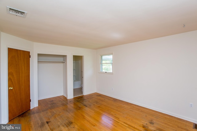 2500 Eberhart Rd, Quakertown, PA 18951 - unfurnished bedroom featuring baseboards, a closet, wood finished floors, and visible vents