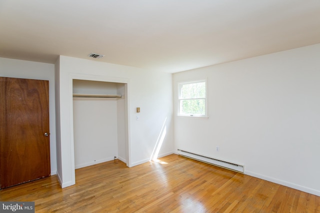 2500 Eberhart Rd, Quakertown, PA 18951 - unfurnished bedroom with visible vents, a closet, baseboards, a baseboard radiator, and light wood-style flooring