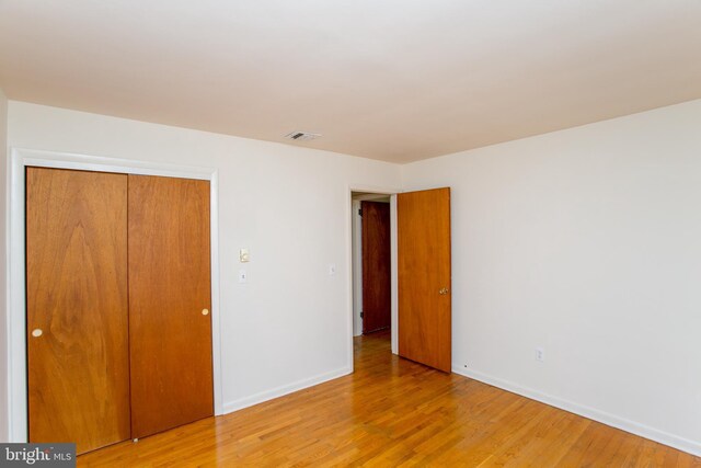2500 Eberhart Rd, Quakertown, PA 18951 - unfurnished bedroom featuring baseboards, visible vents, light wood-style flooring, and a closet
