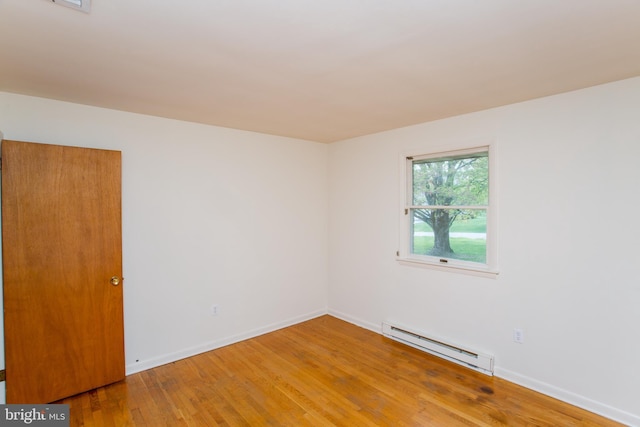 2500 Eberhart Rd, Quakertown, PA 18951 - spare room with baseboards, a baseboard heating unit, and wood finished floors