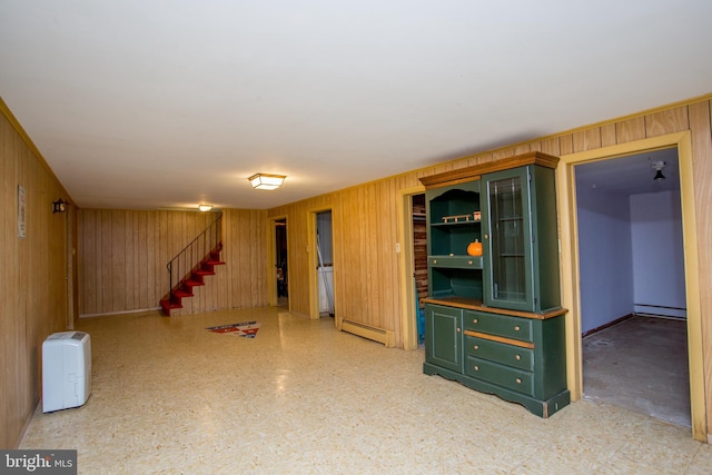 2500 Eberhart Rd, Quakertown, PA 18951 - finished below grade area with a baseboard radiator, stairs, wooden walls, and baseboard heating