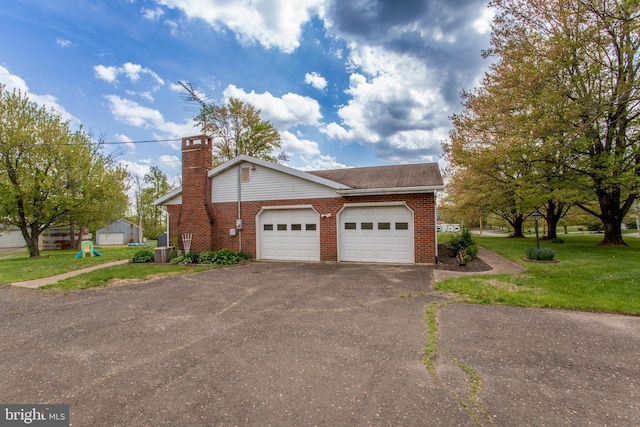 2500 Eberhart Rd, Quakertown, PA 18951 - view of front facade featuring brick siding, an attached garage, a front yard, and aphalt driveway