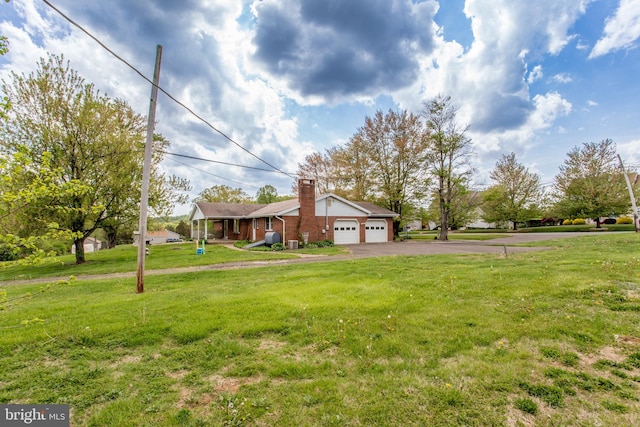 2500 Eberhart Rd, Quakertown, PA 18951 - view of yard featuring a garage and aphalt driveway