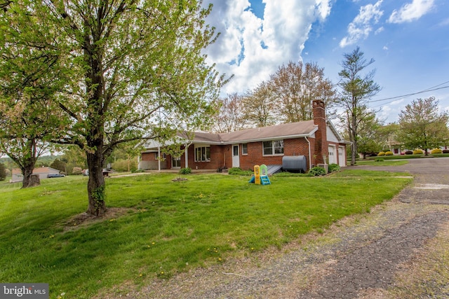 2500 Eberhart Rd, Quakertown, PA 18951 - single story home with brick siding, a garage, heating fuel, and a front lawn