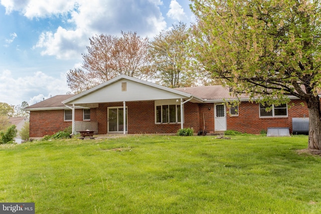 2500 Eberhart Rd, Quakertown, PA 18951 - rear view of house featuring a lawn, brick siding, and heating fuel