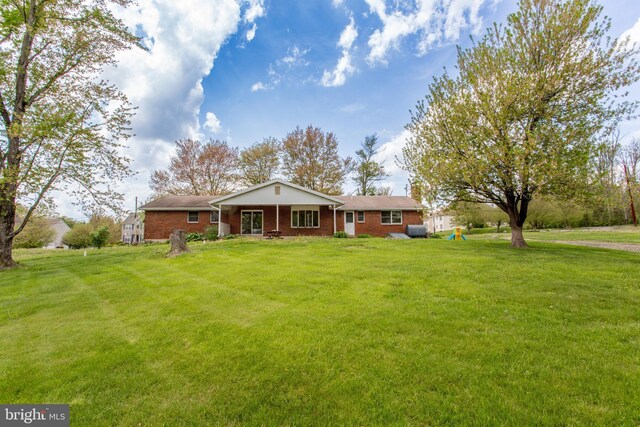 2500 Eberhart Rd, Quakertown, PA 18951 - ranch-style house with brick siding and a front yard
