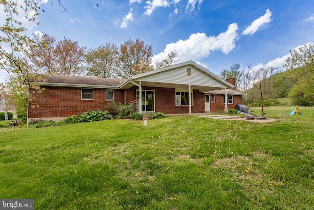 2500 Eberhart Rd, Quakertown, PA 18951 - view of front of house with brick siding, a chimney, and a front yard