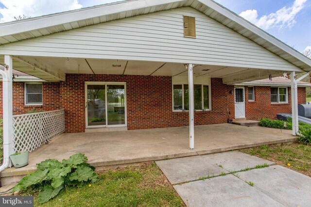 2500 Eberhart Rd, Quakertown, PA 18951 - rear view of property featuring a patio and brick siding