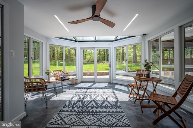 sunroom with ceiling fan and a healthy amount of sunlight