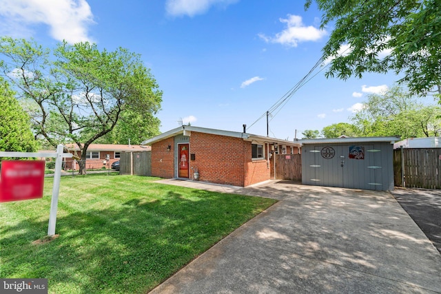 exterior space with brick siding, fence, a front yard, and a storage unit