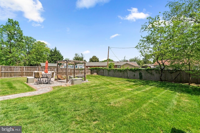 view of yard featuring a patio, a fenced backyard, and a pergola