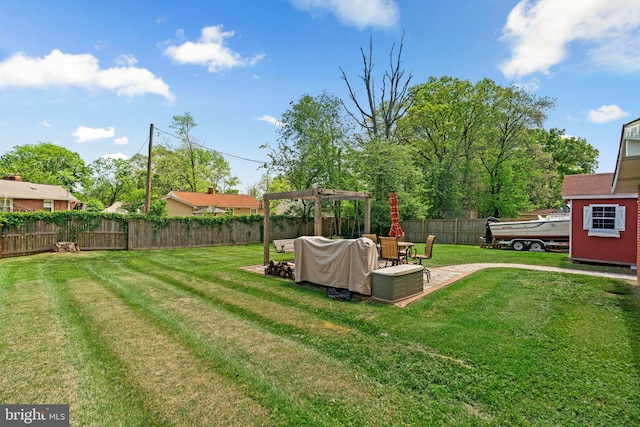 view of yard with a pergola, a fenced backyard, and a patio area