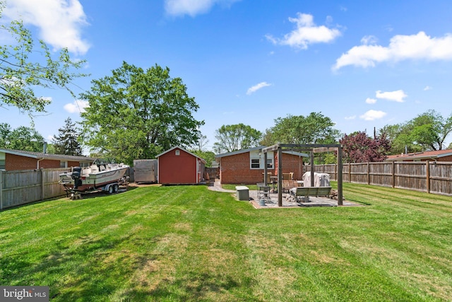 view of yard with an outdoor structure, a pergola, a patio, a fenced backyard, and a shed