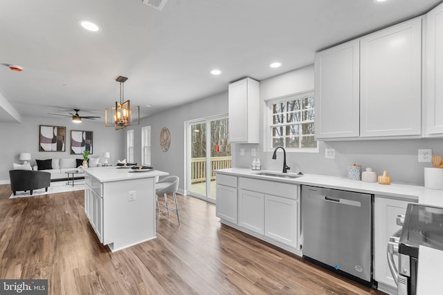 6955 Solomons Island Rd N, Sunderland, MD 20689 - kitchen with white cabinetry, stainless steel appliances, open floor plan, and a sink