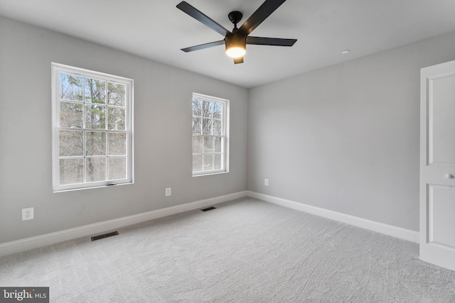 6955 Solomons Island Rd N, Sunderland, MD 20689 - carpeted spare room with baseboards, visible vents, and ceiling fan