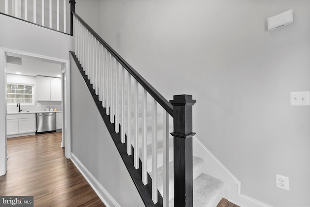 6955 Solomons Island Rd N, Sunderland, MD 20689 - stairs with wood finished floors and baseboards