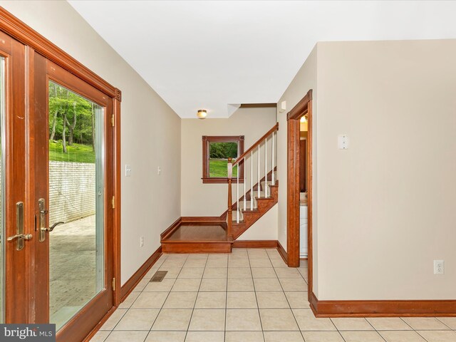 10433 Grindstone Run Rd, Myersville, MD 21773 - entryway featuring stairway, healthy amount of natural light, baseboards, and light tile patterned flooring