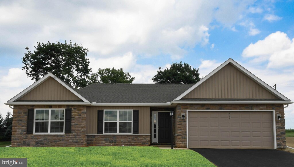 265 Gardenia Ln Lot 4, Lebanon, PA 17042 - view of front of property with driveway, board and batten siding, stone siding, a front yard, and a garage