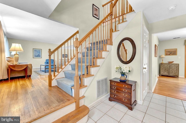 79 Wolfpack Rd, Hamilton, NJ 08619 - staircase with wood-type flooring, baseboards, and visible vents