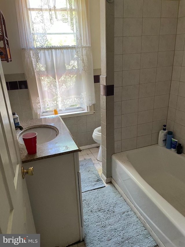 45 W Essex Ave, Lansdowne, PA 19050 - bathroom with vanity, toilet, a wainscoted wall, and tile walls