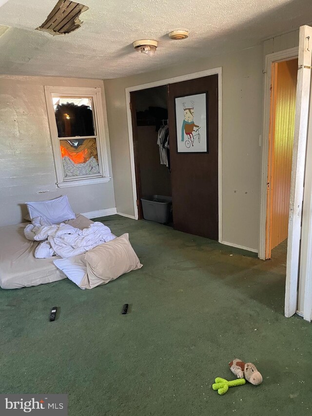 45 W Essex Ave, Lansdowne, PA 19050 - unfurnished bedroom with baseboards, carpet floors, a textured ceiling, and a closet