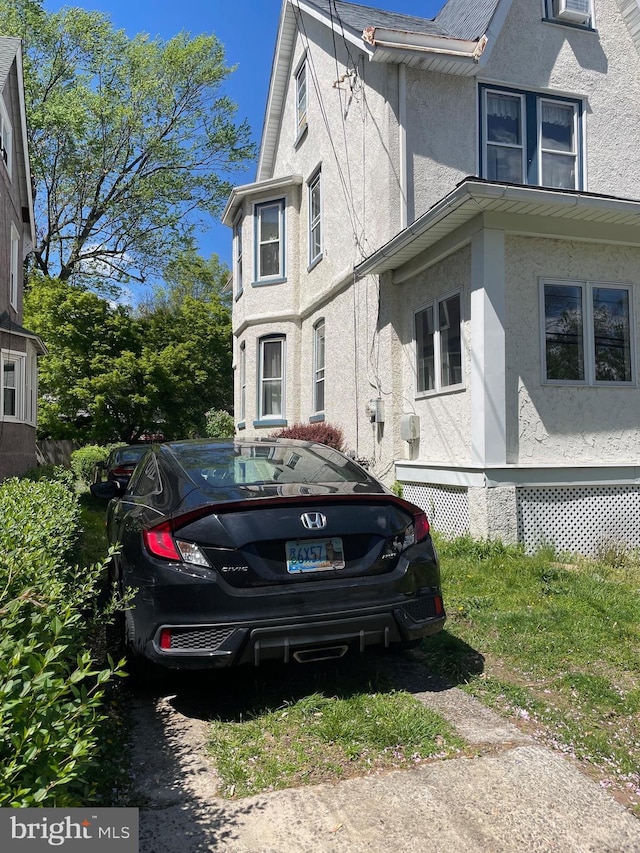 45 W Essex Ave, Lansdowne, PA 19050 - view of side of home featuring stucco siding