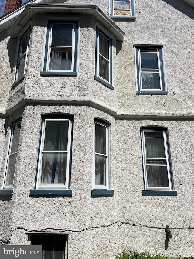 45 W Essex Ave, Lansdowne, PA 19050 - view of side of home featuring a chimney and stucco siding