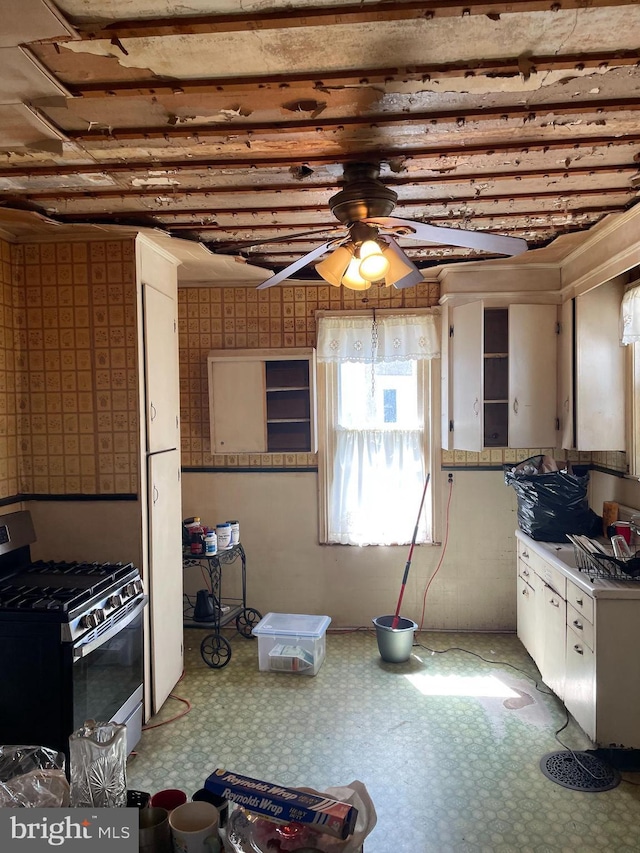 45 W Essex Ave, Lansdowne, PA 19050 - kitchen featuring ceiling fan, gas range, and tile patterned floors