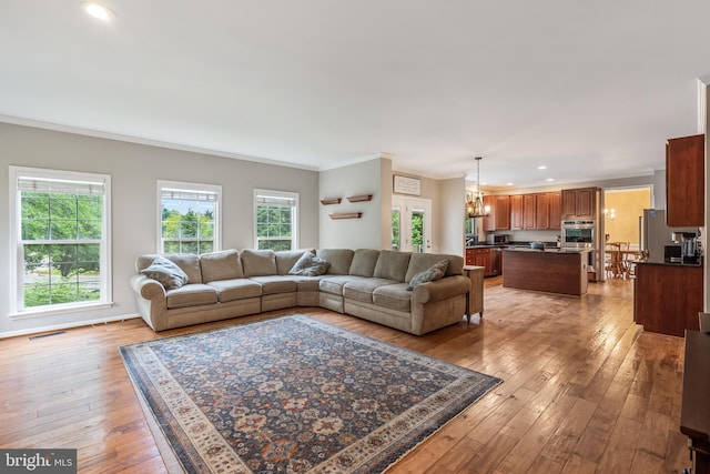 9804 Luck Penny Ct, Bristow, VA 20136 - living area with ornamental molding, a chandelier, wood-type flooring, and recessed lighting