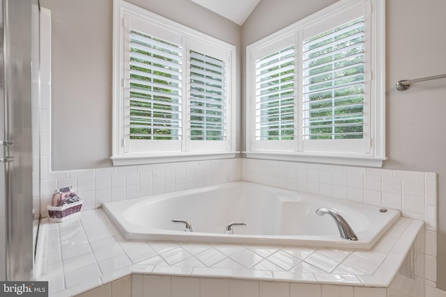 9804 Luck Penny Ct, Bristow, VA 20136 - full bathroom featuring plenty of natural light, a garden tub, and vaulted ceiling