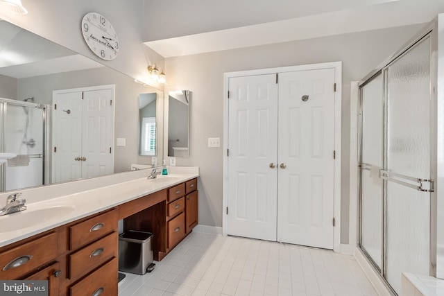 9804 Luck Penny Ct, Bristow, VA 20136 - full bath with tile patterned flooring, a shower stall, double vanity, and baseboards