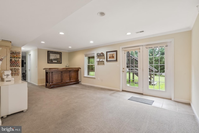 9804 Luck Penny Ct, Bristow, VA 20136 - doorway to outside featuring crown molding, baseboards, light colored carpet, and recessed lighting