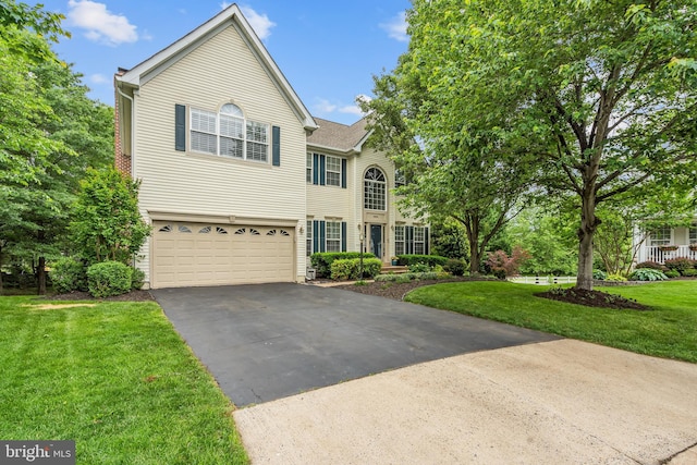 9804 Luck Penny Ct, Bristow, VA 20136 - traditional-style house featuring driveway, a garage, and a front lawn