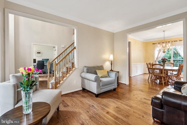9804 Luck Penny Ct, Bristow, VA 20136 - living area with wood finished floors, a chandelier, stairs, crown molding, and baseboards