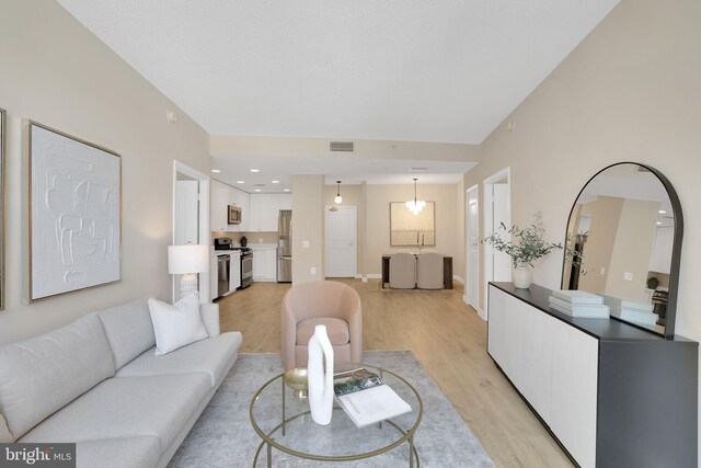 3600 S Glebe Rd Unit 321W, Arlington, VA 22202 - living area featuring light wood-style floors and baseboards