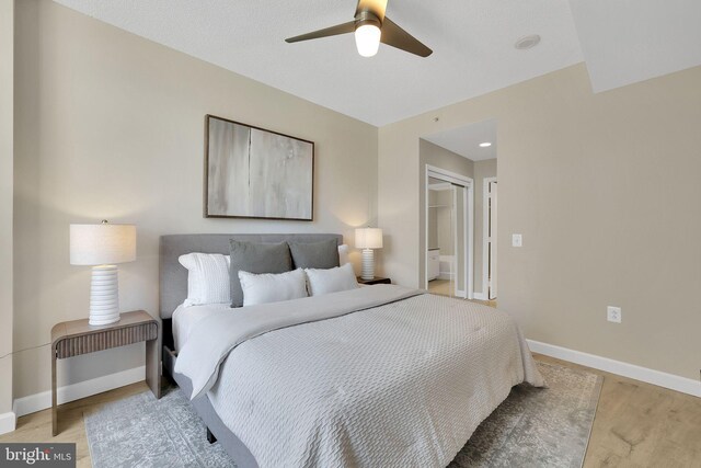3600 S Glebe Rd Unit 321W, Arlington, VA 22202 - bedroom featuring baseboards, wood finished floors, and ceiling fan