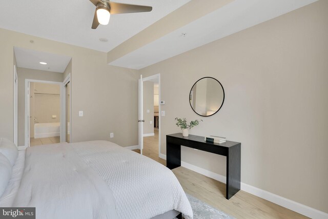 3600 S Glebe Rd Unit 321W, Arlington, VA 22202 - bedroom with light wood-type flooring, baseboards, ensuite bath, and ceiling fan
