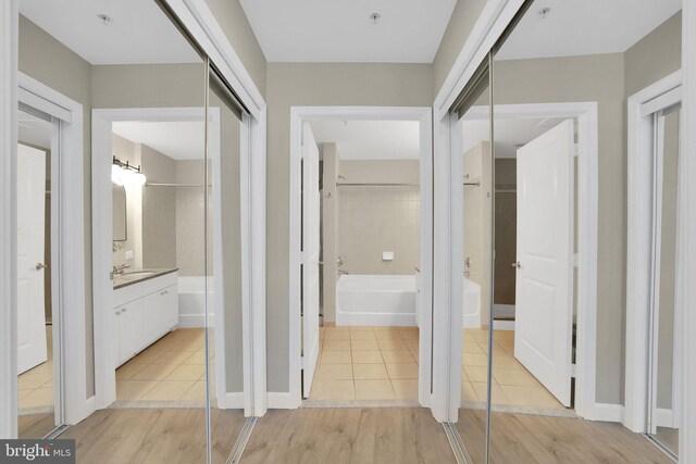 3600 S Glebe Rd Unit 321W, Arlington, VA 22202 - hall featuring light wood-style flooring and a sink