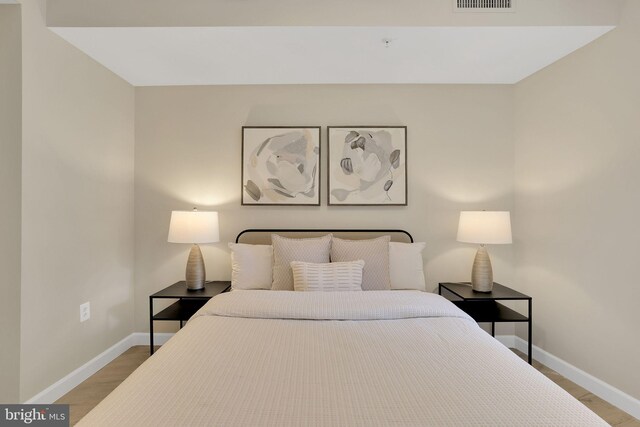 3600 S Glebe Rd Unit 321W, Arlington, VA 22202 - bedroom featuring baseboards and wood finished floors