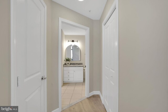 3600 S Glebe Rd Unit 321W, Arlington, VA 22202 - hall featuring light wood finished floors, a sink, and baseboards