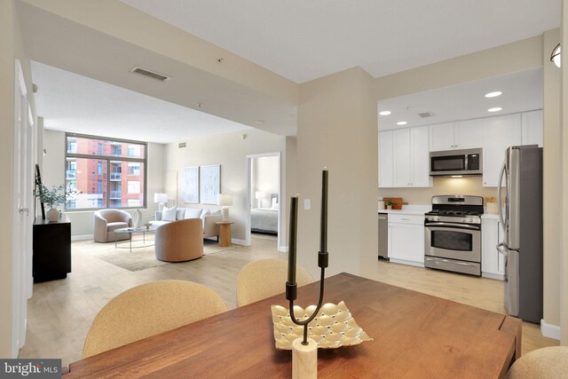3600 S Glebe Rd Unit 321W, Arlington, VA 22202 - dining area featuring light wood-type flooring, recessed lighting, and baseboards